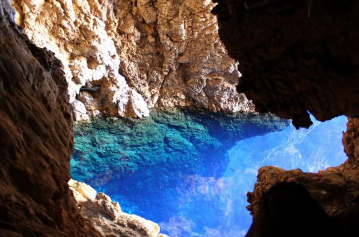 Looking down into the blue Sleeping Pool of the Chinhoyi Caves