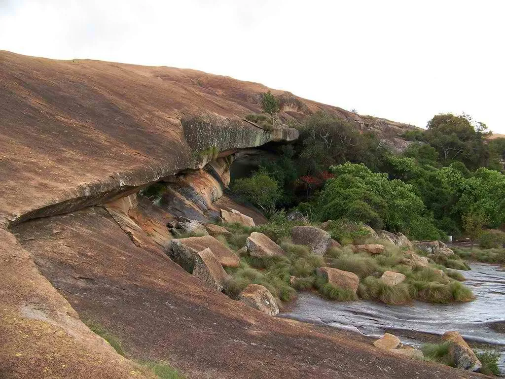 The granite dome of Domboshava with a stream beside it